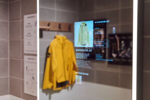 The image shows interactive displays at Adidas’s flagship store