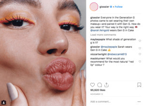 The image shows how Glossier posts social media content of customers using their products as an example of customer retention strategies 