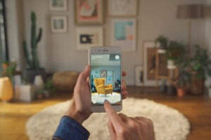 The image shows the use of AR by IKEA in its mobile app as one of the retail customer experience examples