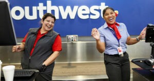 The image shows happy employees in the Southwest Airlines customer service team