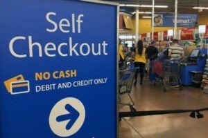 The image shows Walmart offering a self-checkout option to their customers as one of the Retail Customer Experience Trends