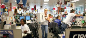 The image shows Zappos customer support team as one of the retail customer experience examples