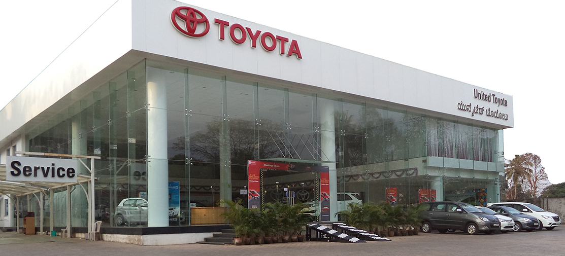 The image shows the inside of one of the Toyota showrooms.