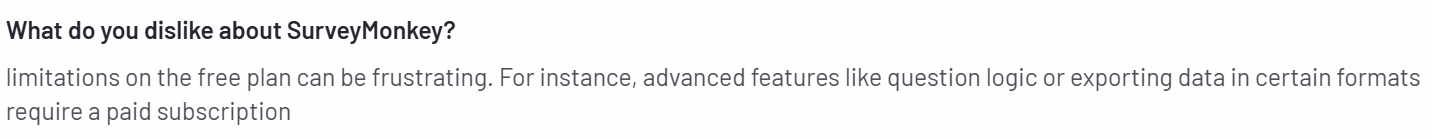 The image shows a customer review on the G2 platform regarding SurveyMonkey’s limited features in the free plan.